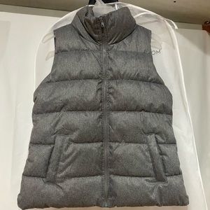 It is a gray jacket vest. Never worn before. It is a size S